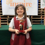 Phoebe Russel with a trophy from the San Francisco Food Bank